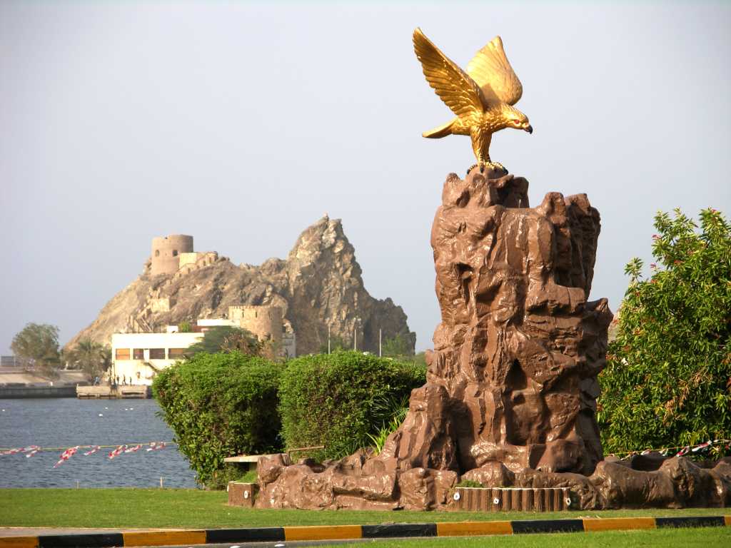 Muscat 03 Mutrah 05 Eagle Fountain and Portuguese watchtower On the corniche by Al-Bahri Rd on the way from Muscat to Mutrah is the eagle fountain. Behind is the restored Portuguese watchtower.